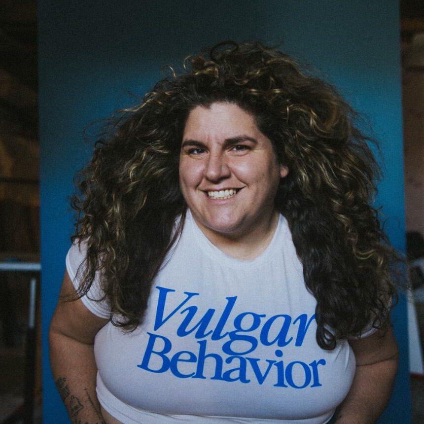 Terri Hofford wearing a t-shirt saying Vulgar behaviour