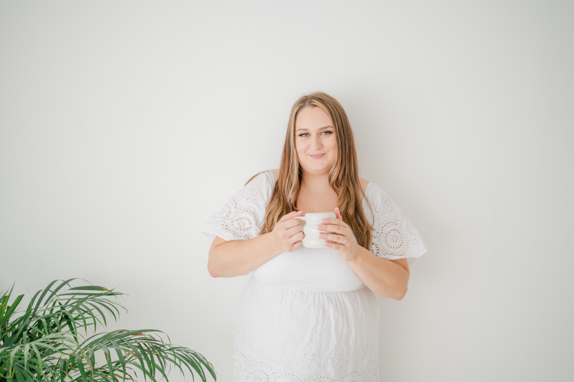 Paige Anderson Photography- Paige holding a white cup